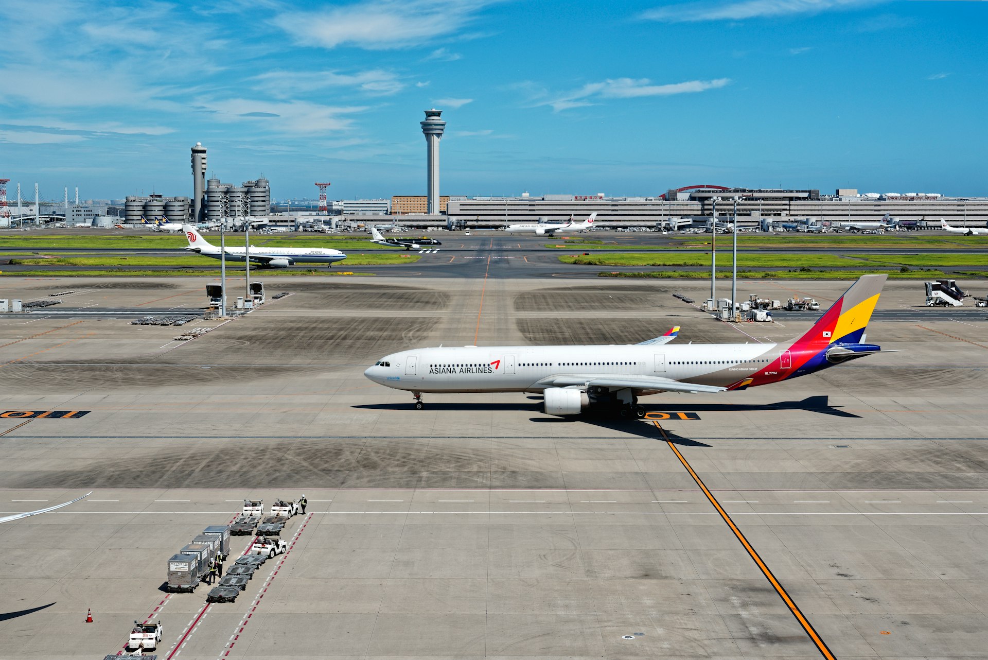 A large jetliner sitting on top of an airport tarmac
